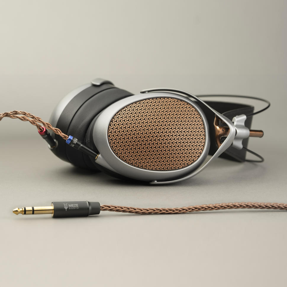 Meze Poet Headphones on a grey background.
